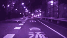 a blurry picture of a street at night with the number 15 on it