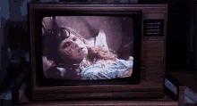 a television with a picture of a ghost on it