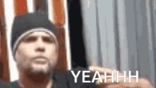 a blurry picture of a man with the word yeahhh on the bottom right