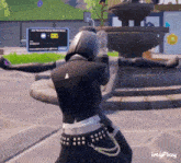 a woman is standing in front of a fountain with her arms outstretched in a video game .