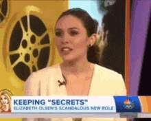 a woman is talking on a television show about keeping secrets