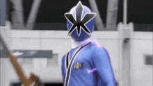 a person in a blue costume with a flower on their helmet