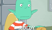 a green cartoon character with the word moldy on his chest
