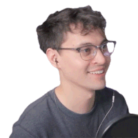 a young man wearing glasses and ear buds is smiling
