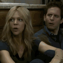 a man and a woman sitting next to each other