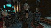 a man in a suit stands in front of a woman in a white shirt and a man in a bucket in a video game