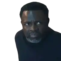 a man with a beard is looking at the camera with a serious look on his face