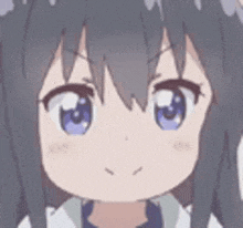 a close up of a cartoon girl 's face with a cat ears .