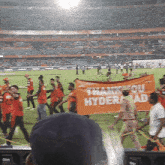 a group of people holding a thank you hyderabad sign