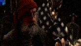 a man with a beard and red hair is talking to another man with long hair .