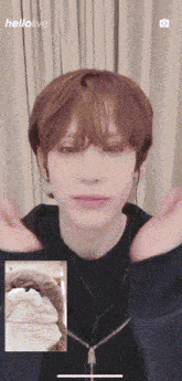 a young man is having a video call with another person and the words hellolive are on the screen