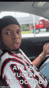 a young man in a car says ayy yee fuckin yooo0000