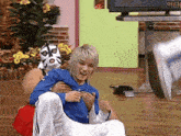a man wearing a mask is holding another man in his arms
