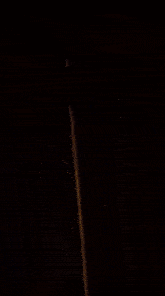 a blurred image of a lamp with a yellow light behind it