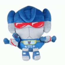 a stuffed toy that looks like a robot with red sunglasses