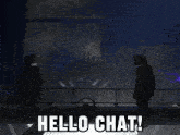two people standing in a dark room with the words hello chat behind them
