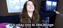 a woman says it 's okay not to like things in a room