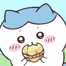a cartoon cat with a blue hat is eating a cupcake with cream cheese frosting .