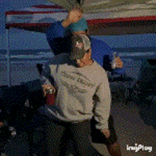 a man wearing a shirt that says ' duck duck ' on it