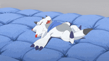 a cartoon character laying on a blue blanket with its eyes closed