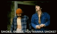 two men standing next to each other with the words smoke , smoke , you wanna smoke written below them .