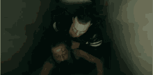 a man is holding another man 's neck in a room .