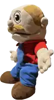 a stuffed toy with a red shirt and blue pants is standing with his arms outstretched