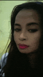 a close up of a woman 's face with pink lipstick on