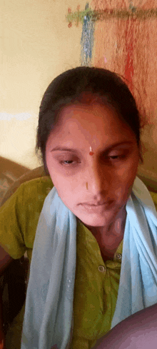 a woman with a blue scarf around her neck