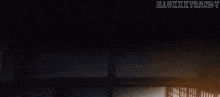 a dark room with a light coming through the window and the words illxxxtrandy on the bottom right