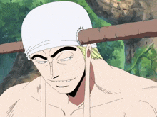 a man with a bandage on his head has a stick on his shoulder