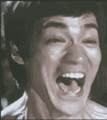 Bruce Lee Laugh GIF - Bruce Lee Laugh Haha No GIFs