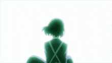 a girl with a green x on her back is sitting in front of a blue and white background