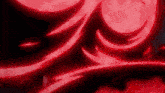a red and black background with a swirl of light