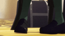 a person 's feet are shown in front of a briefcase