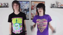 a boy wearing a purple shirt that says weird hearts can 't be broken