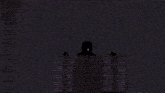 a blurred image of a person 's hand reaching for a light