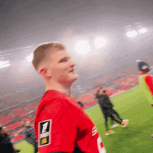 a man in a red jersey with the number 1 on his back