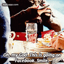a person is sitting at a table with a plate of food and a glass of water and says oh my god