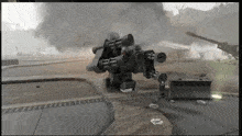 a video game screen shows a robot with a lot of guns on it