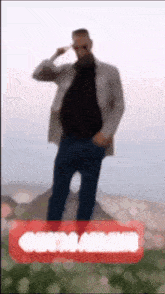 a blurry picture of a man saluting with a red circle that says ' chess arabia ' on it
