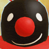 a penguin with a red nose and white eyes