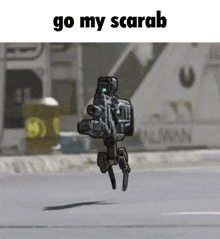 a robot with a gun is flying in the air with the words go my scarab above it .