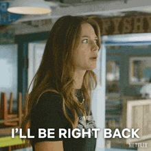 a woman says i 'll be right back in front of a sign that says fish