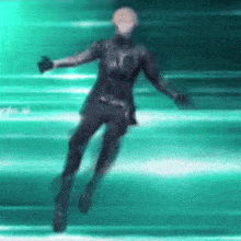 a person in a black suit is flying through the air in a green background .