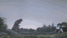 a man is standing in front of a large explosion