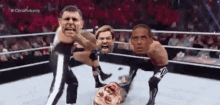 a group of men are wrestling in a ring with a caption that says " cena returns "
