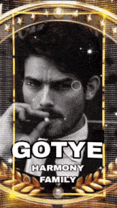 a black and white photo of a man with the name gotye harmony family