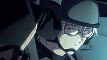 a man wearing a helmet and glasses is looking at another man