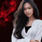 a woman with long black hair wearing a white sweater